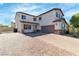 Beautiful two-story home with a brick driveway and an attached two-car garage at 5425 Pride Mountain St, North Las Vegas, NV 89031