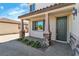 Inviting front porch with stone pillars and landscaped plants, perfect for relaxing at 5425 Pride Mountain St, North Las Vegas, NV 89031