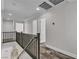 Hallway with hardwood floors and black railing at 5425 Pride Mountain St, North Las Vegas, NV 89031