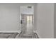 Hallway view showing the kitchen and living area with herringbone-patterned flooring at 5425 Pride Mountain St, North Las Vegas, NV 89031