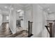 Hallway leading to a laundry room with modern washer and dryer at 5425 Pride Mountain St, North Las Vegas, NV 89031