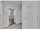 Neutral hallway showcasing wood-style flooring and a glimpse into a bright bedroom at 5425 Pride Mountain St, North Las Vegas, NV 89031