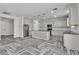 Spacious kitchen with granite counters, island, and herringbone floors, perfect for entertaining at 5425 Pride Mountain St, North Las Vegas, NV 89031
