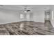 Open living room with ceiling fan and hardwood flooring at 5425 Pride Mountain St, North Las Vegas, NV 89031