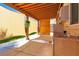 View of outdoor kitchen and patio with custom sun shades at 5425 Pride Mountain St, North Las Vegas, NV 89031