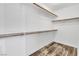 Walk-in closet with wood-look flooring and shelving at 5425 Pride Mountain St, North Las Vegas, NV 89031