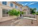 Charming townhome featuring a well-maintained desert landscaped front yard and walkway at 56 Belle Ridge Ave, Las Vegas, NV 89123
