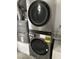 Modern, stainless steel, stacked washer and dryer set with energy guide at 56 Belle Ridge Ave, Las Vegas, NV 89123