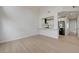 Bright living room with kitchen view, wood floors, and soaring ceilings with a modern feel at 56 Belle Ridge Ave, Las Vegas, NV 89123