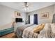 This bedroom features wood-look floors, neutral walls, and a comfortable bed with stylish bedding at 5751 E Hacienda Ave # 154, Las Vegas, NV 89122