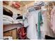 Walk-in closet with shelving, clothes, and storage items to maximize space at 5751 E Hacienda Ave # 154, Las Vegas, NV 89122