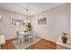 Charming dining area with a white table and light blue chairs under a chandelier at 5751 E Hacienda Ave # 154, Las Vegas, NV 89122