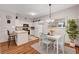 Bright kitchen and dining area featuring modern appliances, white cabinetry, and stylish decor at 5751 E Hacienda Ave # 154, Las Vegas, NV 89122