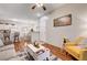 Inviting living room featuring wood floors with open layout to the dining and kitchen area at 5751 E Hacienda Ave # 154, Las Vegas, NV 89122