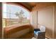 Cozy patio with privacy screen, chair and outdoor table at 5751 E Hacienda Ave # 154, Las Vegas, NV 89122