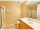 A modest bathroom features a vanity, sink, toilet and shower/tub combo at 62 E Serene Ave # 115, Las Vegas, NV 89123