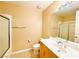 A modest bathroom features a vanity, sink, toilet and shower/tub combo at 62 E Serene Ave # 115, Las Vegas, NV 89123