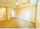 Bright bedroom with a ceiling fan, plush carpet, and mirrored closet doors at 62 E Serene Ave # 115, Las Vegas, NV 89123
