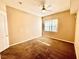 Spacious bedroom with plush carpet and a ceiling fan at 62 E Serene Ave # 115, Las Vegas, NV 89123