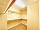 Walk-in closet featuring built-in shelving and storage at 62 E Serene Ave # 115, Las Vegas, NV 89123