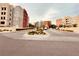 Inviting entrance to the Manhattan Condominiums, with mature landscaping at 62 E Serene Ave # 115, Las Vegas, NV 89123