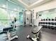 Community gym with weight machines, free weights and mirrored wall at 62 E Serene Ave # 115, Las Vegas, NV 89123