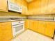 View of the kitchen area featuring ample cabinet space and modern appliances at 62 E Serene Ave # 115, Las Vegas, NV 89123