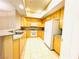 Bright kitchen with granite countertops, stainless steel appliances, and wood cabinets at 62 E Serene Ave # 115, Las Vegas, NV 89123