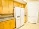Close-up of the kitchen appliances and countertop area; features a white refrigerator and cabinets at 62 E Serene Ave # 115, Las Vegas, NV 89123