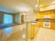Open floor plan featuring a kitchen with granite countertops and stainless steel appliances at 62 E Serene Ave # 115, Las Vegas, NV 89123