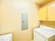 A basic laundry room featuring a washer, dryer and cabinets for storage at 62 E Serene Ave # 115, Las Vegas, NV 89123