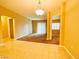 Spacious living room with tile and carpet, featuring an open floor plan and neutral colors at 62 E Serene Ave # 115, Las Vegas, NV 89123