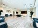 This spacious lounge includes large windows, seating, and accent walls at 62 E Serene Ave # 115, Las Vegas, NV 89123