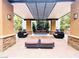 Outdoor seating area with a built-in fire pit, comfortable seating, and lush landscaping at 62 E Serene Ave # 115, Las Vegas, NV 89123