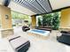 Inviting outdoor patio area with a built-in fire pit, grill, and cozy seating at 62 E Serene Ave # 115, Las Vegas, NV 89123