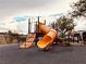 Neighborhood playground features a fun, colorful slide to keep children entertained at 62 E Serene Ave # 115, Las Vegas, NV 89123