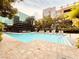 Large pool with plenty of seating and foliage at 62 E Serene Ave # 115, Las Vegas, NV 89123