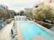 Aerial view of a stunning pool surrounded by seating at 62 E Serene Ave # 115, Las Vegas, NV 89123