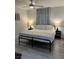Bright bedroom with a large bed, neutral colors, and modern lighting fixtures at 621 S 9Th St, Las Vegas, NV 89101