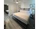 Spacious bedroom featuring a large bed, contemporary decor, and connecting door at 621 S 9Th St, Las Vegas, NV 89101