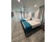 This bedroom features two beds with a ceiling fan and a relaxing, neutral color palette at 621 S 9Th St, Las Vegas, NV 89101