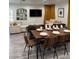 Dining room showcasing a large table set for a meal, adjacent to a living area with comfortable sofas at 621 S 9Th St, Las Vegas, NV 89101