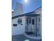 Close up of charming front porch with ironwork and unique architectural details on a bright, sunny day at 621 S 9Th St, Las Vegas, NV 89101