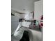 Bright kitchen features white cabinetry, stainless appliances and granite countertops providing a stylish workspace at 621 S 9Th St, Las Vegas, NV 89101