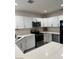 Stylish kitchen featuring stainless steel appliances, white cabinets, and granite countertops providing an elegant cooking area at 621 S 9Th St, Las Vegas, NV 89101