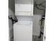 Compact laundry area featuring a stacked washer and dryer unit, ensuring convenience and efficiency at 621 S 9Th St, Las Vegas, NV 89101