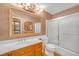 Bathroom with a marble countertop, large mirror, and a combined shower and bathtub at 6508 Peppermill Dr, Las Vegas, NV 89146