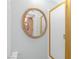 Bathroom featuring a shower with a glass door and a decorative gold mirror at 6508 Peppermill Dr, Las Vegas, NV 89146