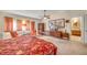 Bedroom with a bed, seating area, and a view to the bathroom at 6508 Peppermill Dr, Las Vegas, NV 89146