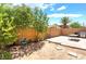 Large backyard with a combination of patio and planting areas at 6529 Hartwood Rd, Las Vegas, NV 89108